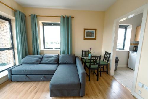 a bedroom with a bed and a table and chairs at Bright View in Dublin
