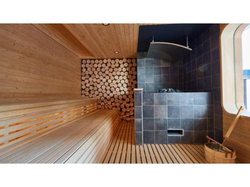 a sauna with wooden flooring and a tub with at 8HOTEL CHIGASAKI - Vacation STAY 87519v in Chigasaki