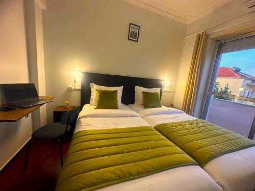 Katil atau katil-katil dalam bilik di Lisabonna Guest House