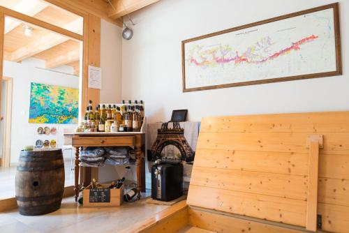 a wine tasting room with a large map on the wall at Ame de la Terre in Ruffey-lès-Échirey