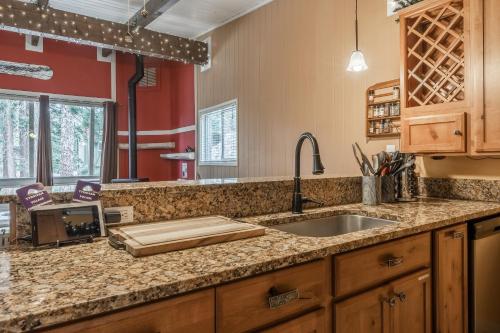 a kitchen with a sink and a counter top at Tyrolean Village 6 2 Bedroom 1 and a Half Bath Sleeps 6 Walk to Lift Steps to town shuttle in Mammoth Lakes