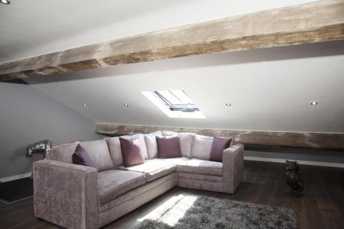 a living room with a couch and a window at EPIC Apart Hotel - Duke Street in Liverpool