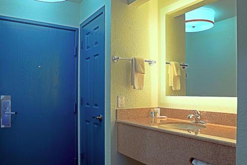 a bathroom with a sink and a large mirror at Comfort Inn & Suites Sierra Vista near Ft Huachuca in Sierra Vista