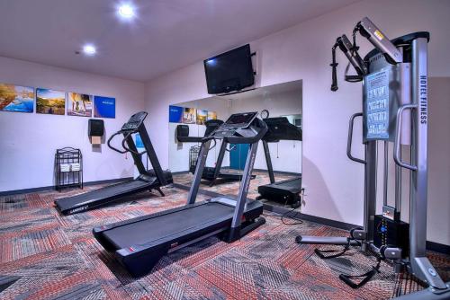 a gym with several tread machines in a room at Comfort Inn & Suites Sierra Vista near Ft Huachuca in Sierra Vista