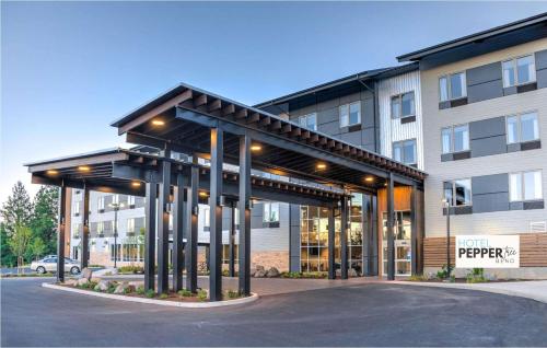 a building with a pavilion in front of a building at Hotel Peppertree Bend, BW Premier Collection in Bend