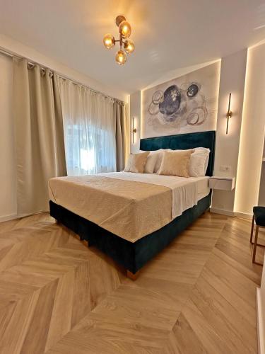 a bedroom with a large bed in a room at Villa Olivetta heritage residence in Crikvenica