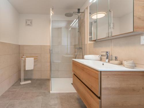 a bathroom with a sink and a shower at Villa Felding Top 4 in Bad Hofgastein