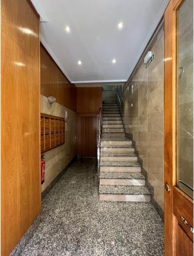 a hallway with stairs in a building at Apartamento Céntrico Pamplona San Fermin in Pamplona