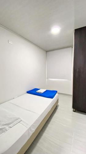 Postel nebo postele na pokoji v ubytování Apartahotel222 Pereira 401