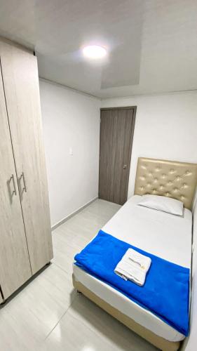 Postel nebo postele na pokoji v ubytování Apartahotel222 Pereira 401