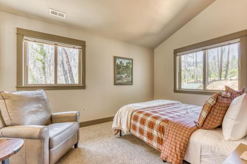 a bedroom with a bed and a chair at McKenzie River Retreat in Vida