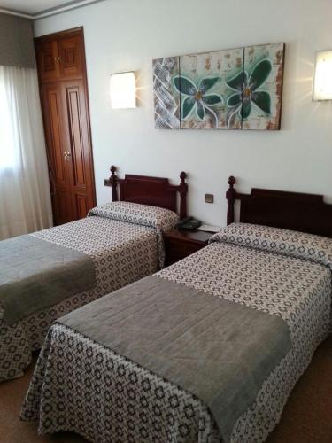 Letto o letti in una camera di Hotel Don Pepe