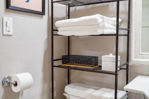 a bathroom with a towel rack next to a toilet at Colorful downtown condo, 2 bedrooms, king bed in Seattle