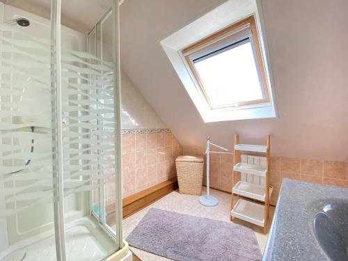 a bathroom with a shower and a sink at Holiday Home in Plogonnec near Sandy Beaches in Plogonnec