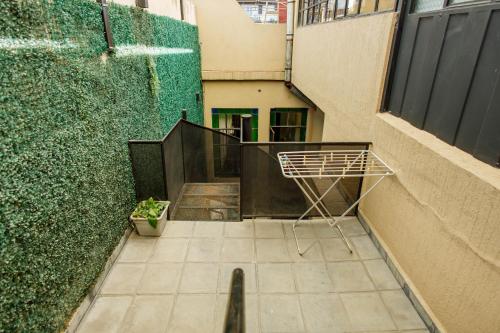 a person walking down a stairway in a building at REGINA HOME in San Salvador de Jujuy