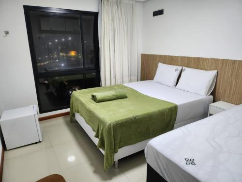 Tempat tidur dalam kamar di Apt 202 e 203 no ZUPPOLINI GARDEN HOTEL Bananeiras PB