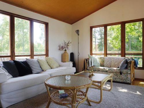 a living room with a couch and a table at 6 person holiday home in ÅKERSBERGA-By Traum in Åkersberga