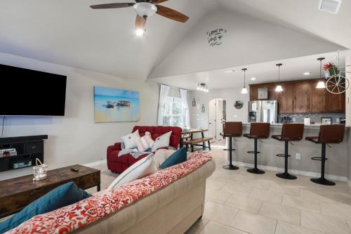 a living room with a couch and a table at The Overlook Cottage . King Bed . Mini Lake View in Canyon Lake