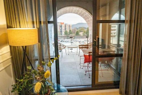 a room with a view of a balcony with a table and chairs at 2 Bedroom 2 bath 1 Car on Lonsdale Street in Canberra