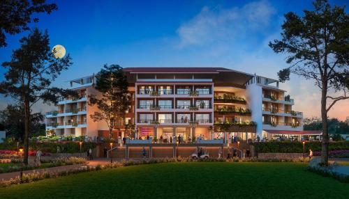 a rendering of a hotel at night at Whistling Woodzs Resort in Dandeli