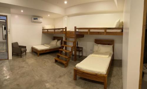 Postel nebo postele na pokoji v ubytování P&B Residences Legazpi