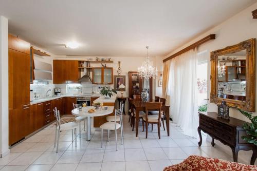 a kitchen and dining room with a table and chairs at Dream Home - Heraklion Center in Heraklio
