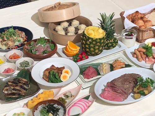 a table with many different types of food on it at Hotel Sankyo Fukushima in Fukushima