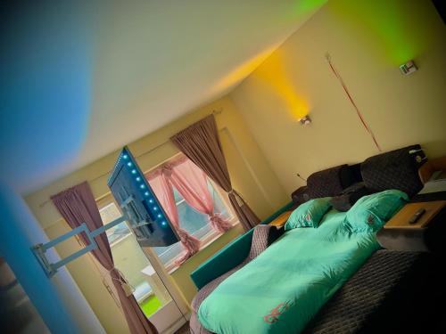 a bedroom with a bed and a flat screen tv at Luxury design apartment in Ostend