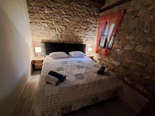 Postel nebo postele na pokoji v ubytování Apartman Zrinka