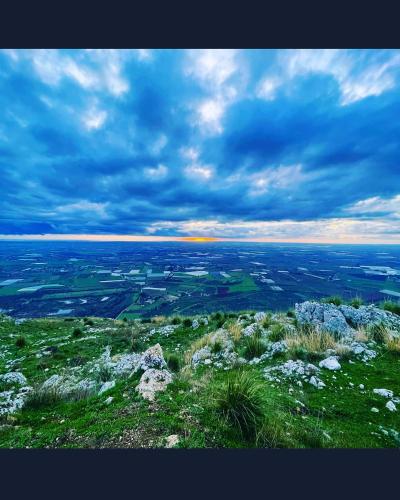a view of a field from the top of a hill at Sweet Home Sofia in Norma