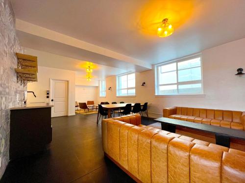 a living room with couches and a table and chairs at Heart of Hollywood Apartment - 2Bed 2Bath in Los Angeles