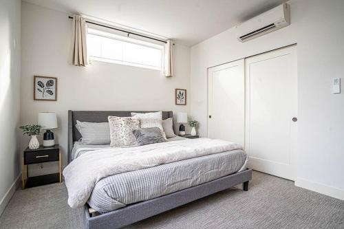 a bedroom with a large bed with a window at New modern Nordic style home, View, Rooftop deck in Seattle
