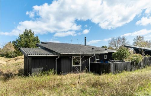 a house on the side of a hill at Awesome Home In Grenaa With Kitchen in Grenå