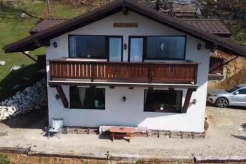 an aerial view of a house with a balcony at Chalet Betleem in Măgura