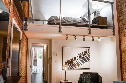 a room with two bunk beds on the ceiling at Historic Charm in Victoria BC's Waddington Alley in Victoria