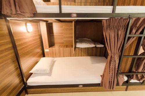 Ένα ή περισσότερα κρεβάτια σε δωμάτιο στο Brown Bean 2 Hotel