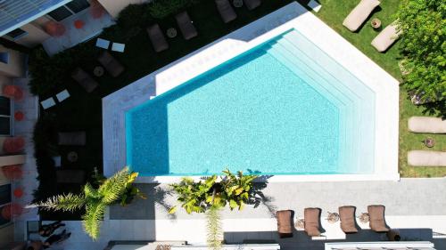 an overhead view of a swimming pool in a building at Saronis Suites in Saronida