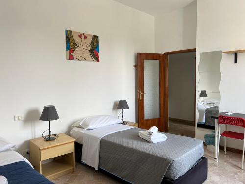 A bed or beds in a room at Bologna Fiera Fani Apartment
