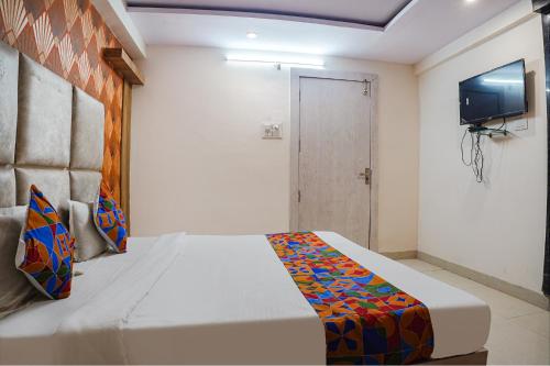 Postel nebo postele na pokoji v ubytování FabHotel The Pannies