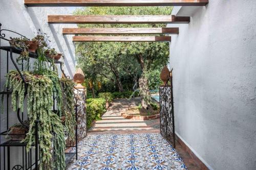 an entrance to a house with a gate and a rug at Villa Grimodi in Caronia Marina