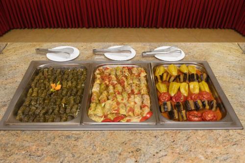 a tray of different types of food on a counter at Arzni Health Resort in Arzni
