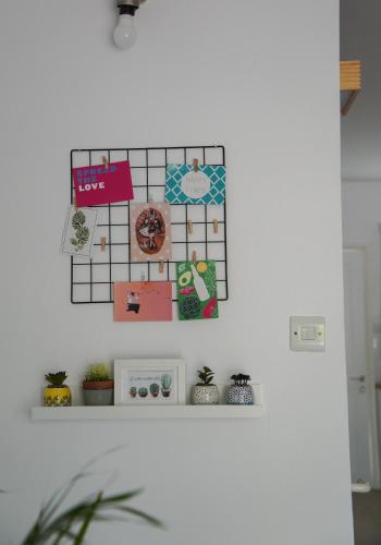 a shelf with a calendar on a wall at Rachel suite by the pool Paphos in Paphos City