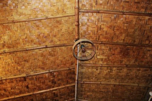a room with a wall with a clock on it at Infinity Hill Village Mukteshwar in Mukteswar