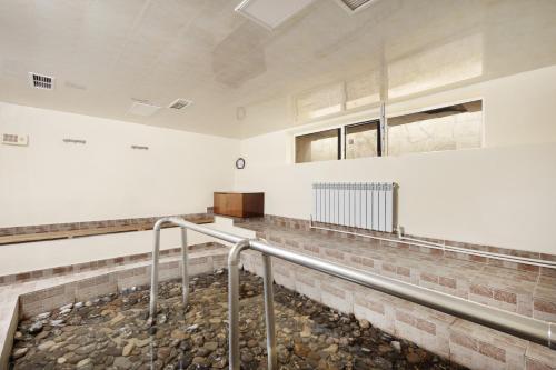 an empty room with a metal handrail in a building at Arzni Health Resort in Arzni
