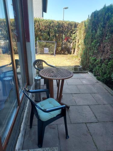 a patio with a table and a chair and a table at FERIENWOHNUNG Marina in Bad Ems