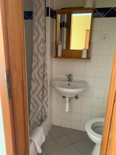 Koupelna v ubytování Hotel Pacifik