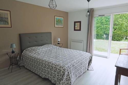 Ένα ή περισσότερα κρεβάτια σε δωμάτιο στο À l'ombre des Tilleuls