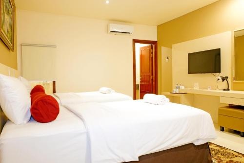BI Executive Hotelにあるベッド