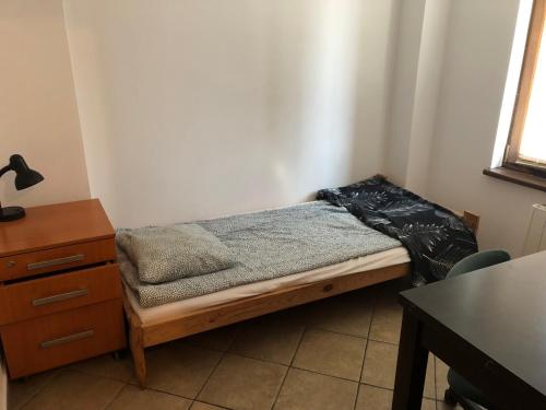 Postel nebo postele na pokoji v ubytování Kwatery Mamma Mia Opawska 1a