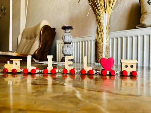 a toy train sitting on the floor in a room at Liel in Tbilisi City